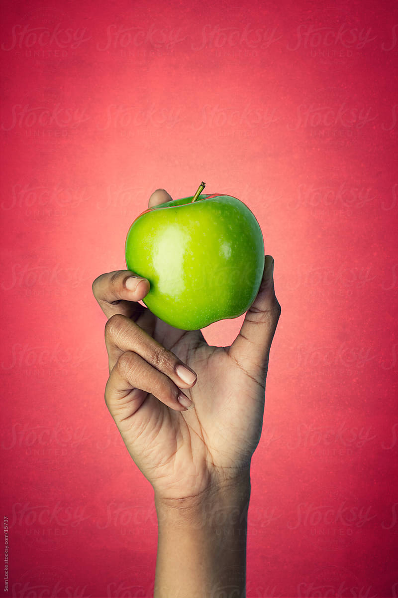 Healthy: Woman Holds Whole Granny Smith Apple