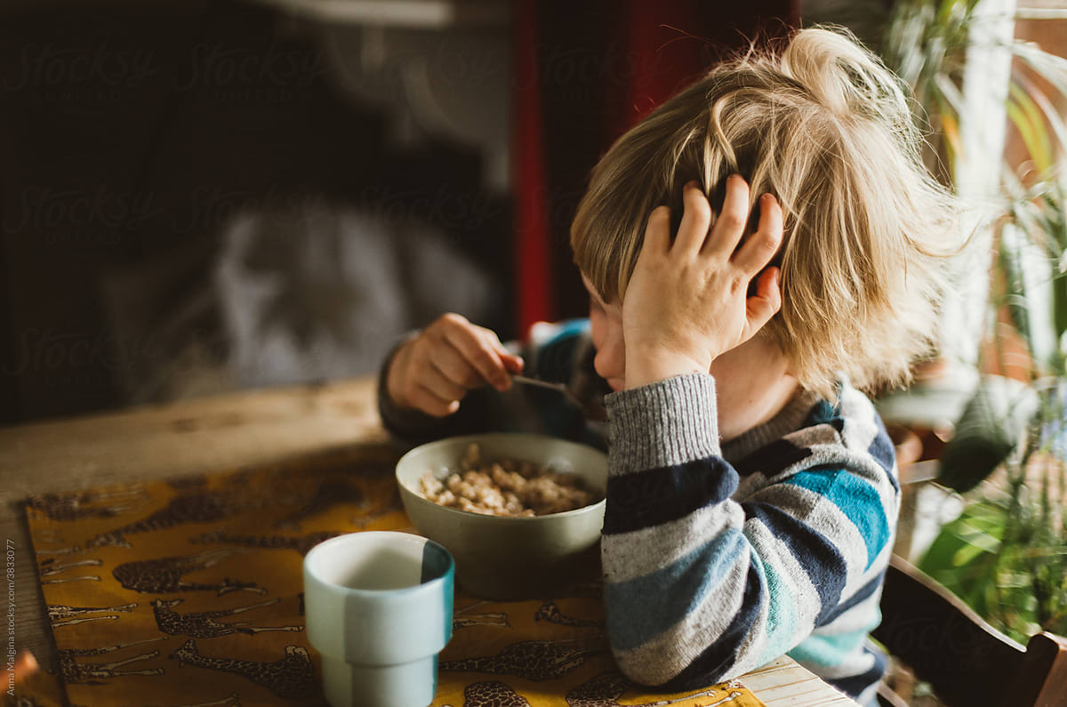A child eating a hot porridge
