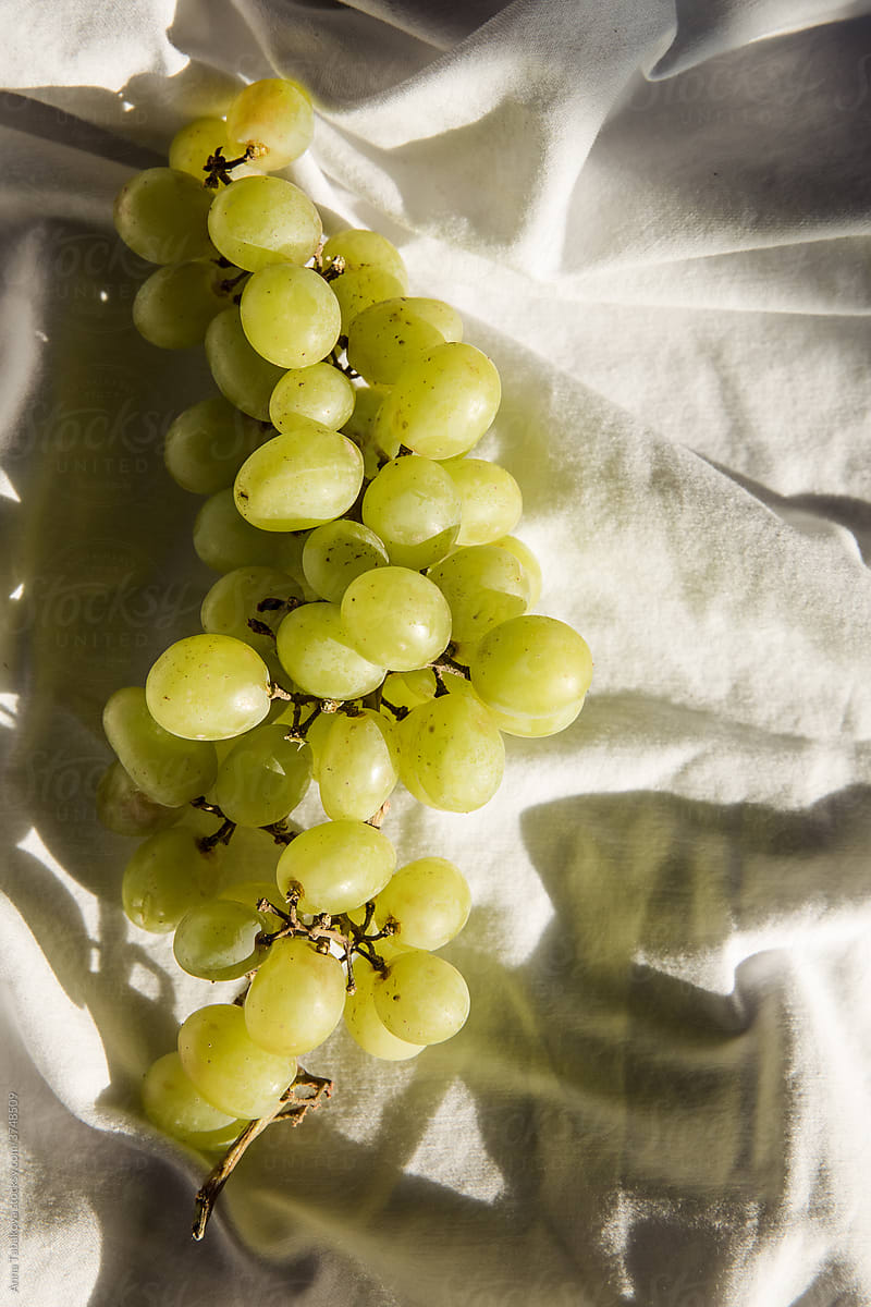 Green grapes flat lay in the sun