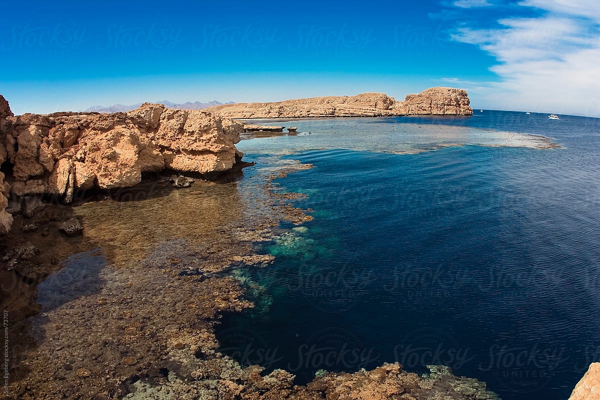 Rocky coastline and ocean view to coral reefs