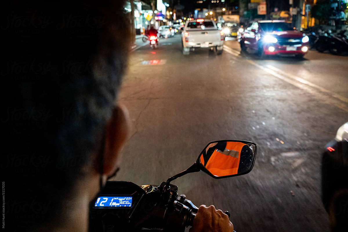 Riding on the back of a motorcycle taxi in Pattaya, Thailand