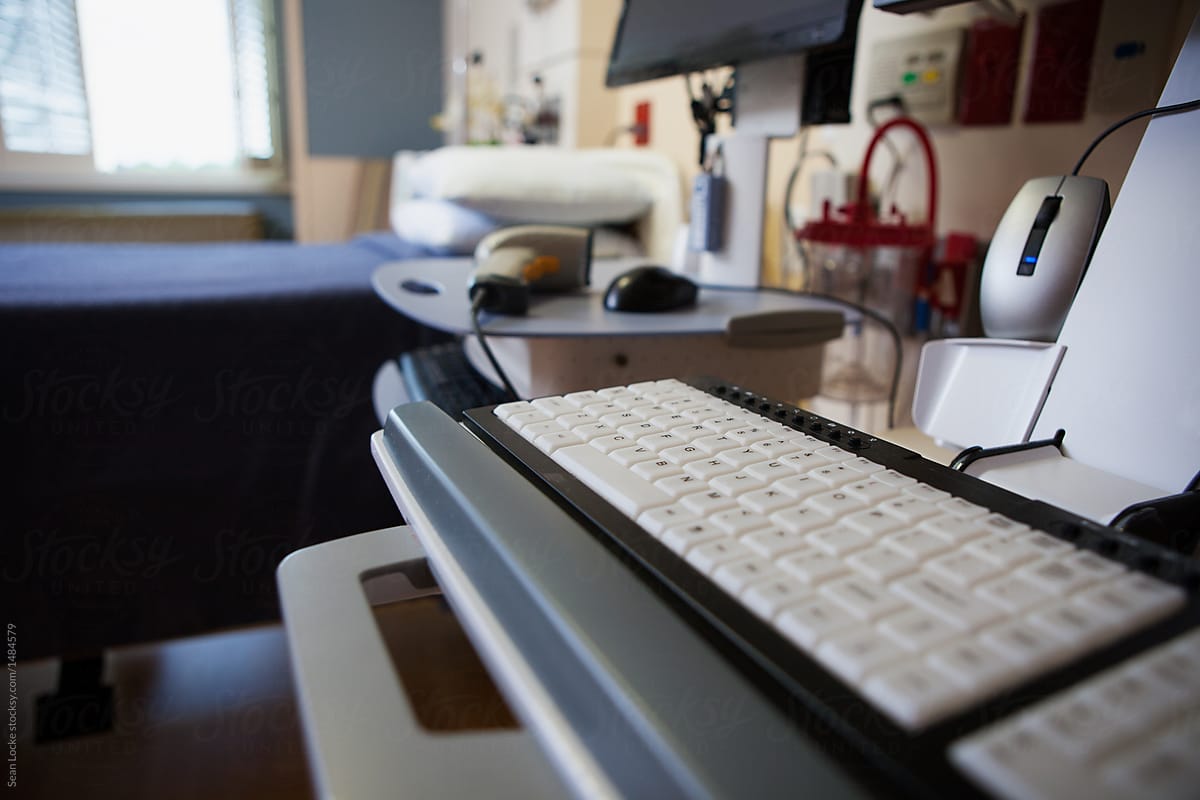Hospital: Focus On Computer Keyboard At Patient Room Workstation