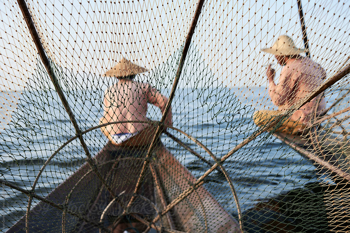 Unrecognizable traditional Shan fishermen resting