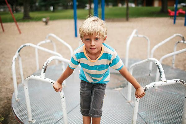 young baseball player sits on the bench by Stocksy Contributor Kelly  Knox