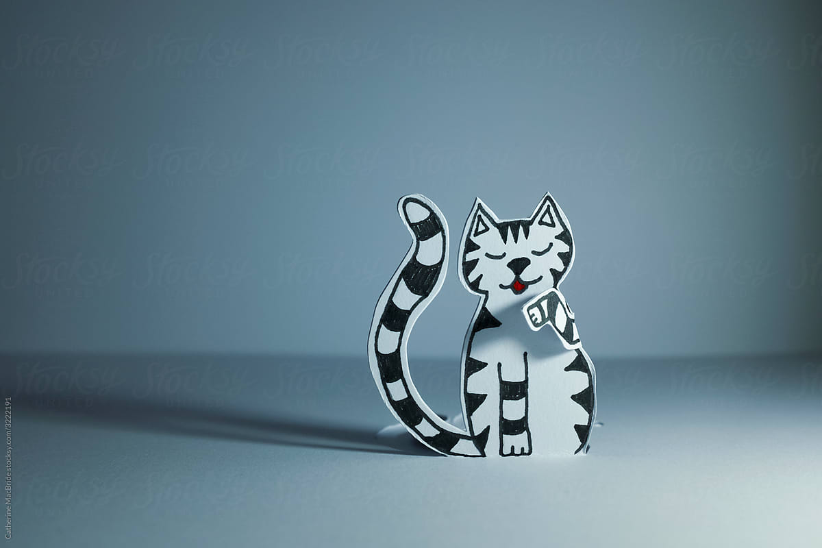 Paper Craft Cartoon Cat cleaning paw