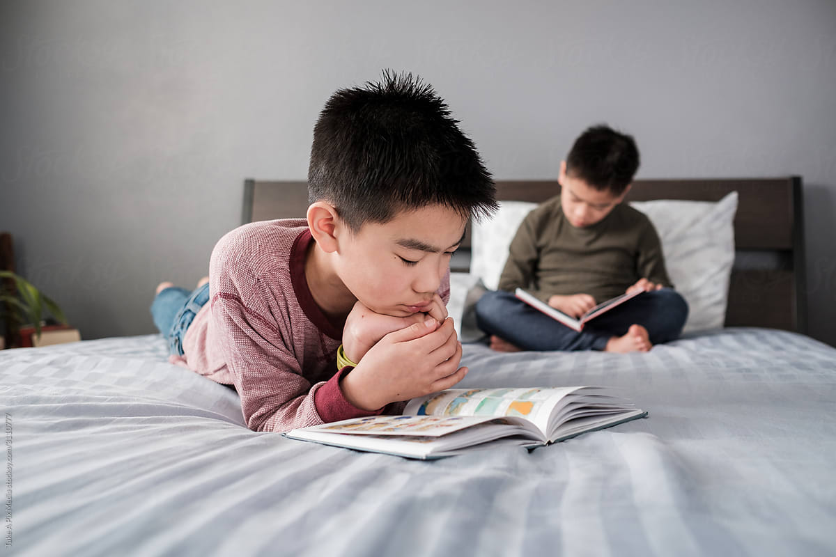 Asian Kids Reading Books At Home by Stocksy Contributor Take A Pix Media  - Stocksy