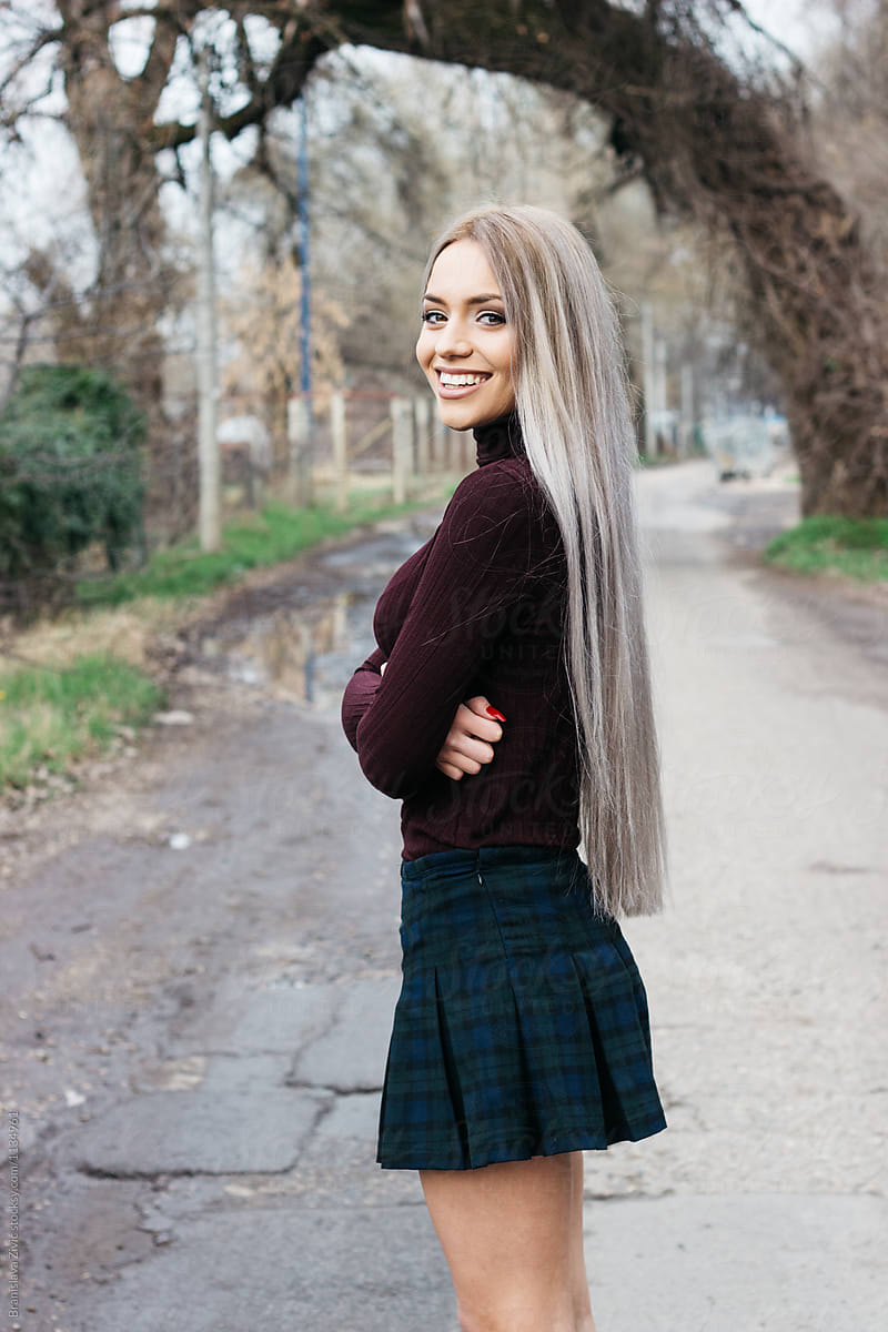 Portrait of a beautiful female model with long hair from behind