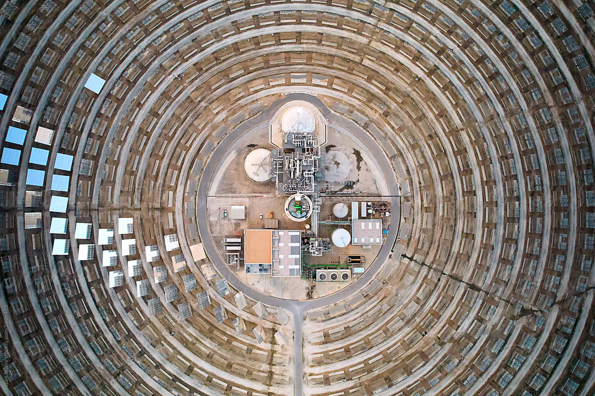 Aerial birds eye view, concentrated solar power station's energy tower