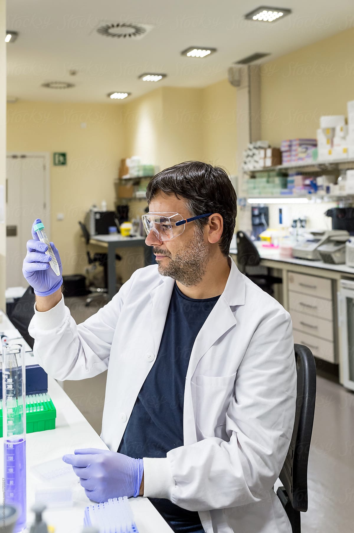 Male scientist using a pipette in a DNA laboratory