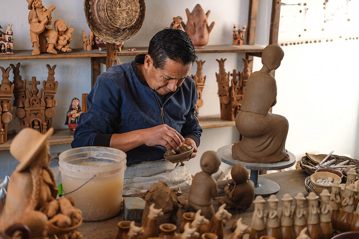 Artisan working with clay