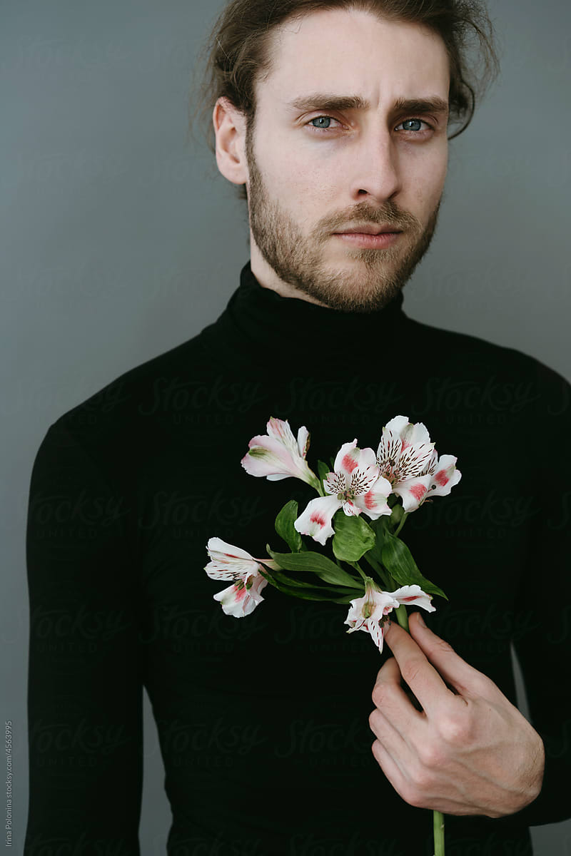 Modern man with flowers.