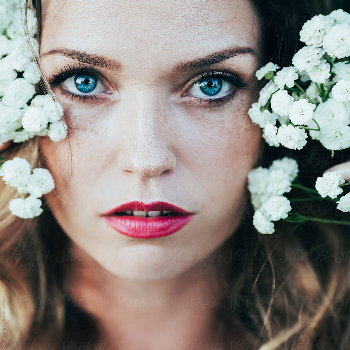 Portrait Of A Beautiful Young Woman With Freckles And Blue Eyes By Stocksy Contributor Jovana 