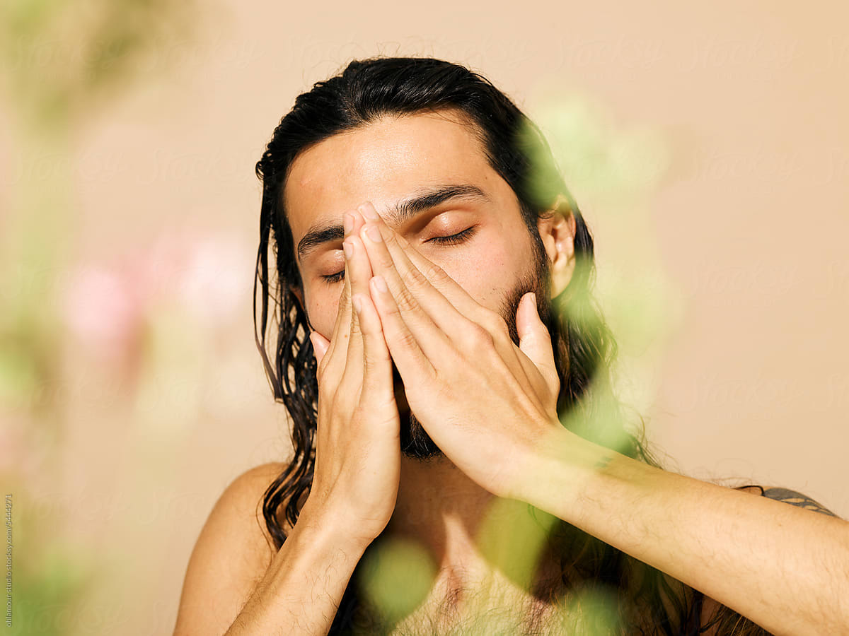 Man using face wash after shower