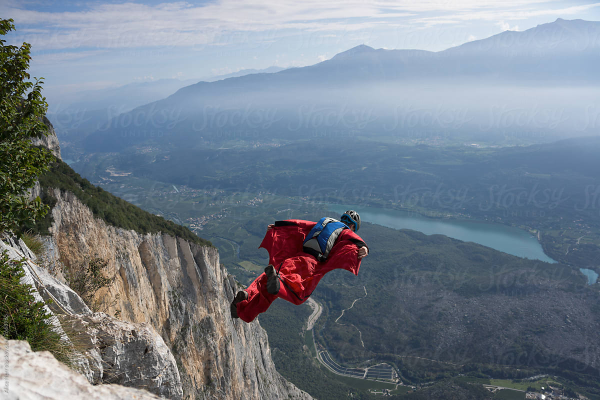 BASE jumper flying in mountains