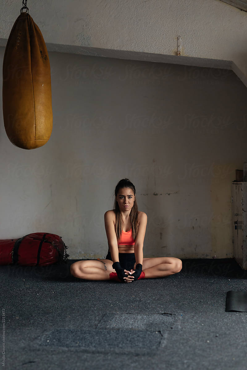 Woman Stretching In Gym By Stocksy Contributor Mihajlo Ckovric
