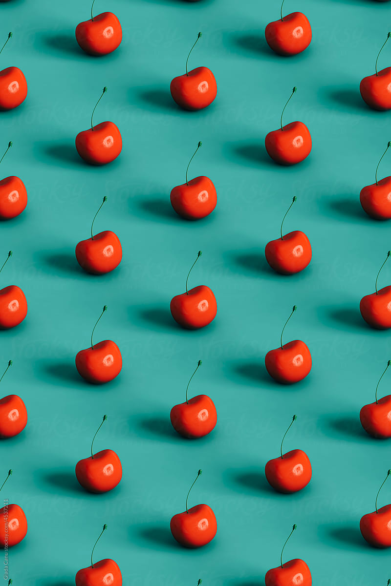 pattern of cherries on a blue background