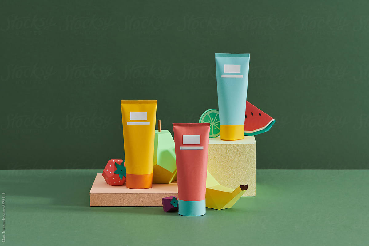 Colorful assorted cosmetics bottles and tropical fruit