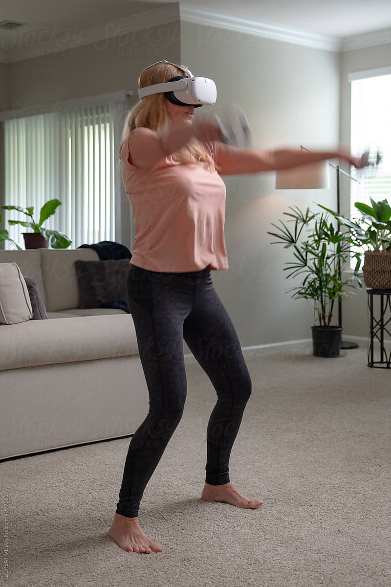 Woman playing virtual reality game.