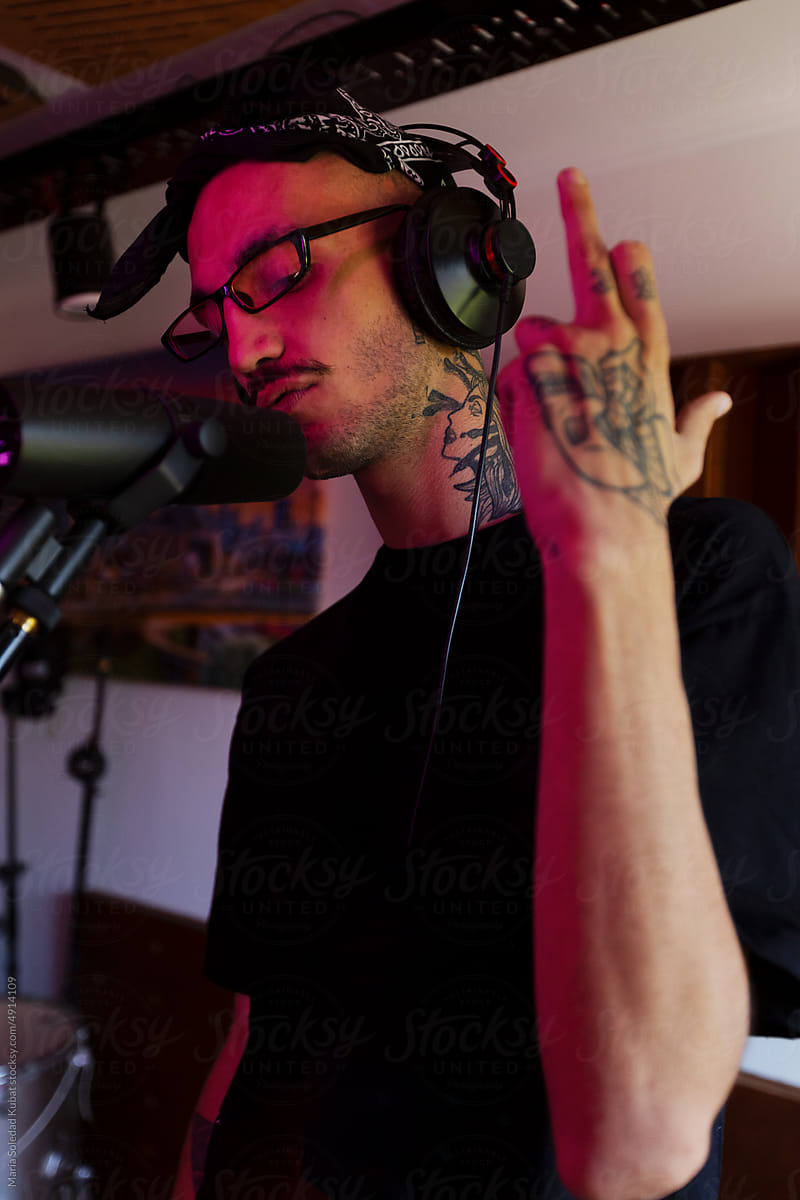 Man In Recording Studio Singing Into Microphone