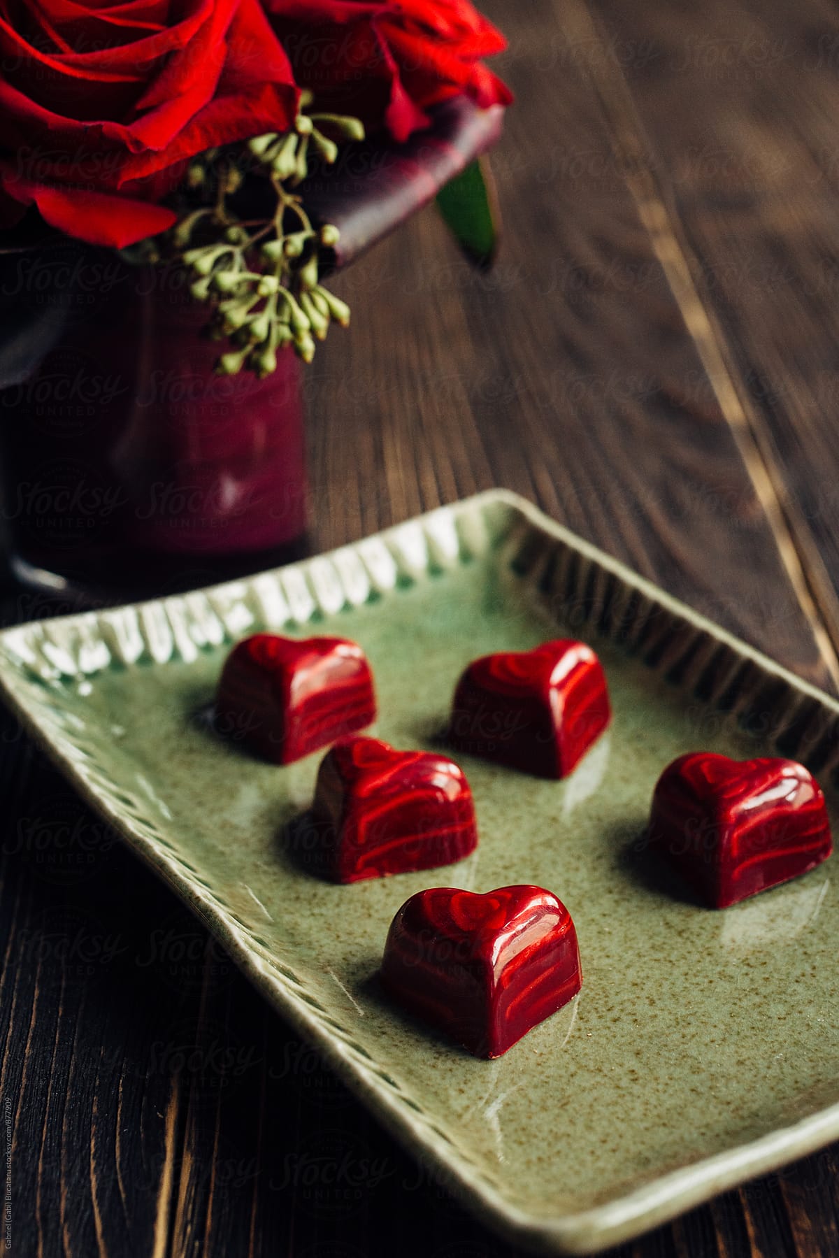Hear shaped red chocolates on a tray