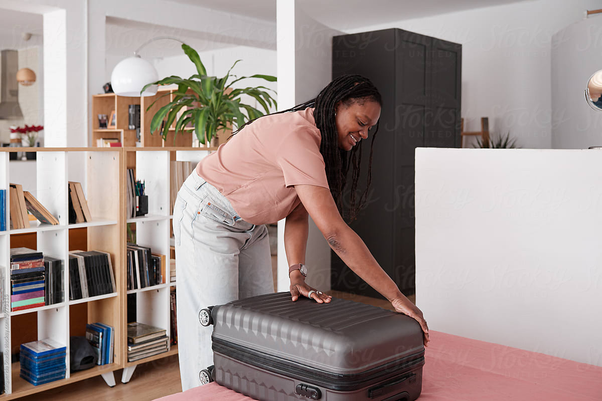 woman opening a suitcase