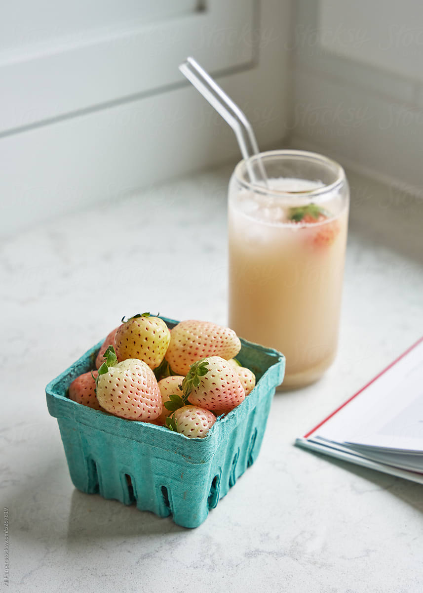 Pineberry (white strawberry) smoothie on counter