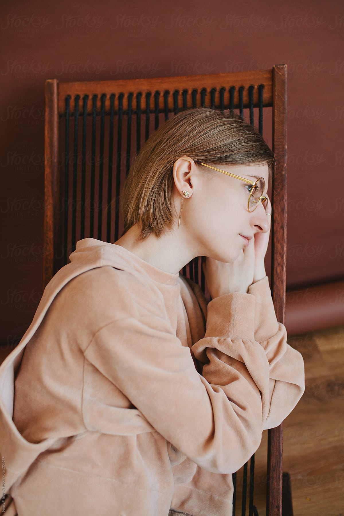 Portrait Of A Young Blonde Girl Lying In A Folding Chair By Stocksy