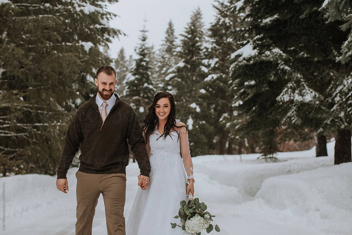 Wedding Couple Walking in Winter Landscape