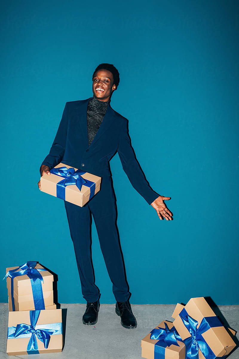 Man posing with presents
