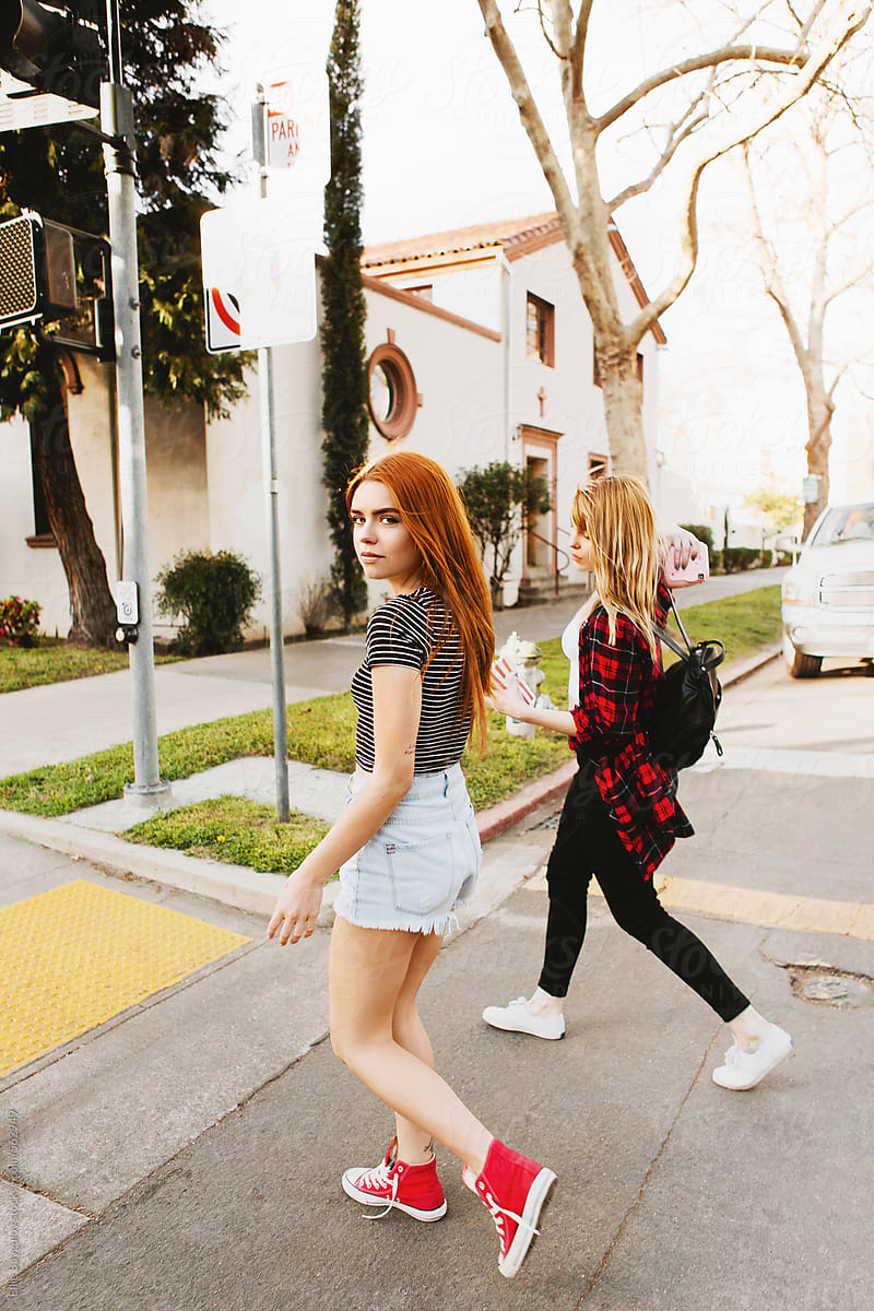 Two Girls Crossing The Street By Stocksy Contributor Ellie Baygulov Stocksy