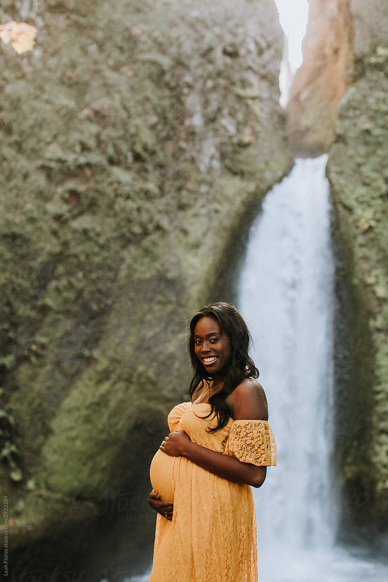 Beautiful Pregnant Black Woman In Front Of Oregon Waterfall By Stocksy Contributor Leah