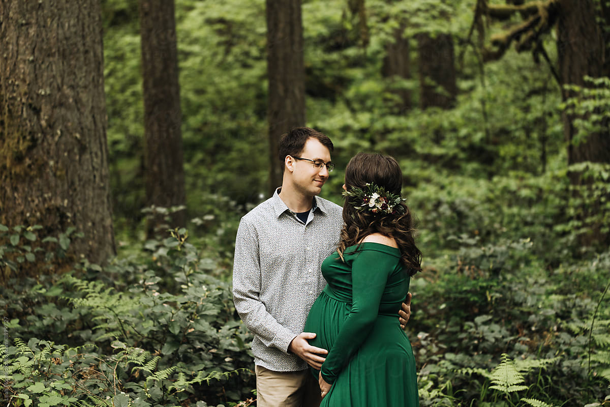 Loving Couple Expecting Baby in Woods