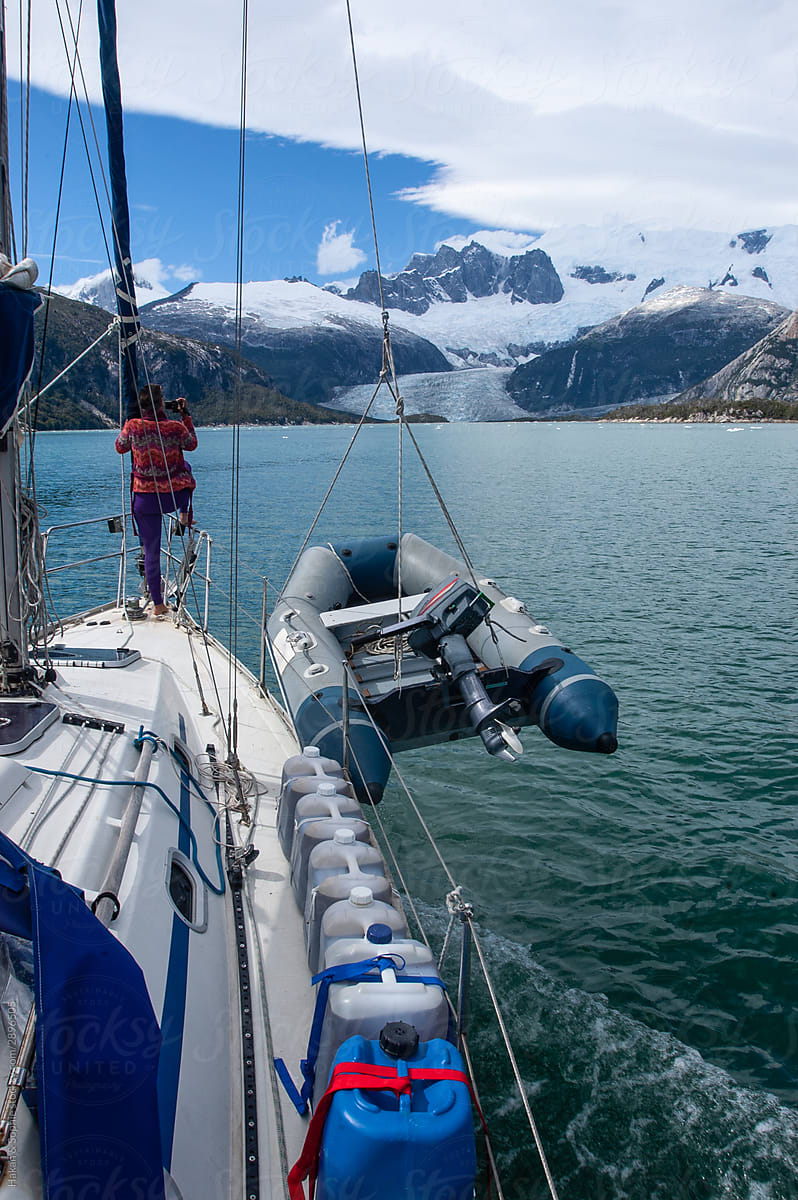 A woman sailing toward the tongue of a glacier.