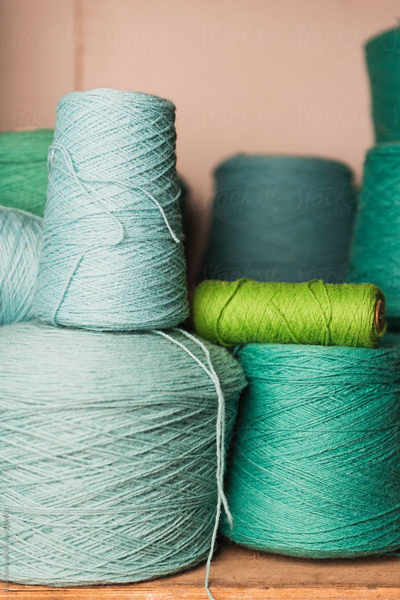 Big rolls of wool in different shades of green