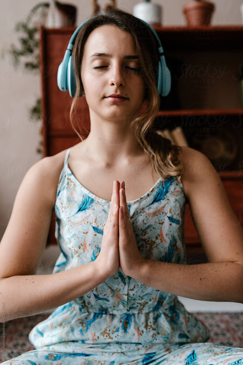 Woman listening to music and meditating
