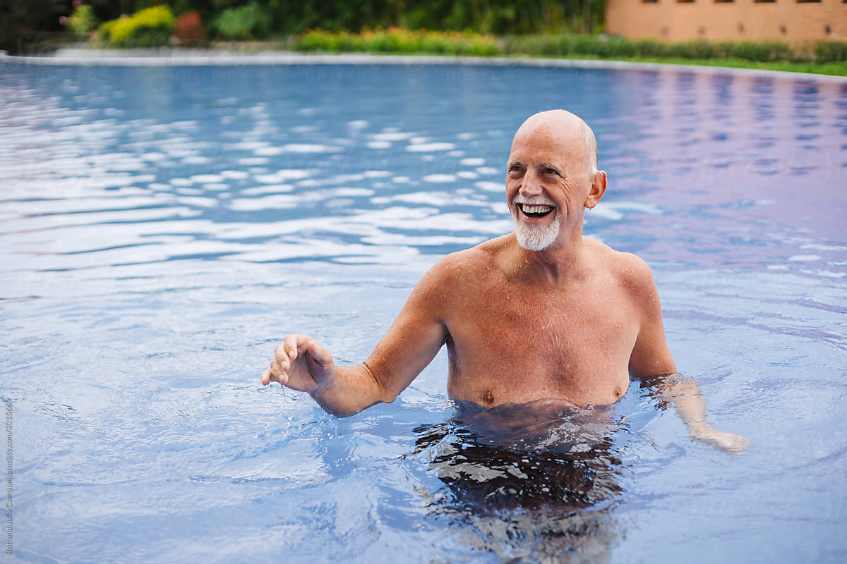 Healthy, active retirement-age man enjoying the pool.