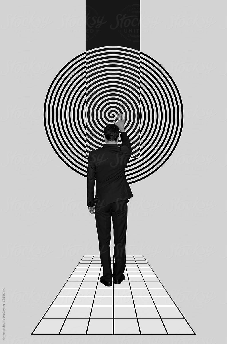 Man holding his hand on a hypnotic spiral