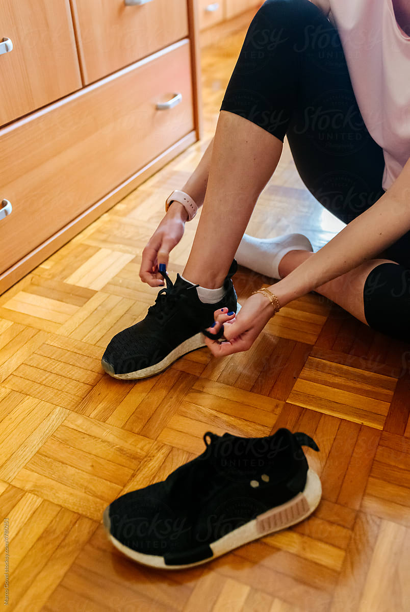 Woman putting on her shoes