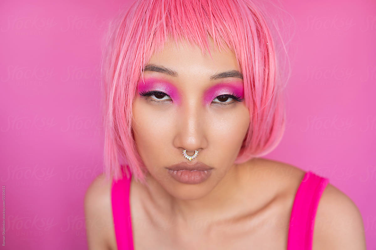 Asian woman with pink hair