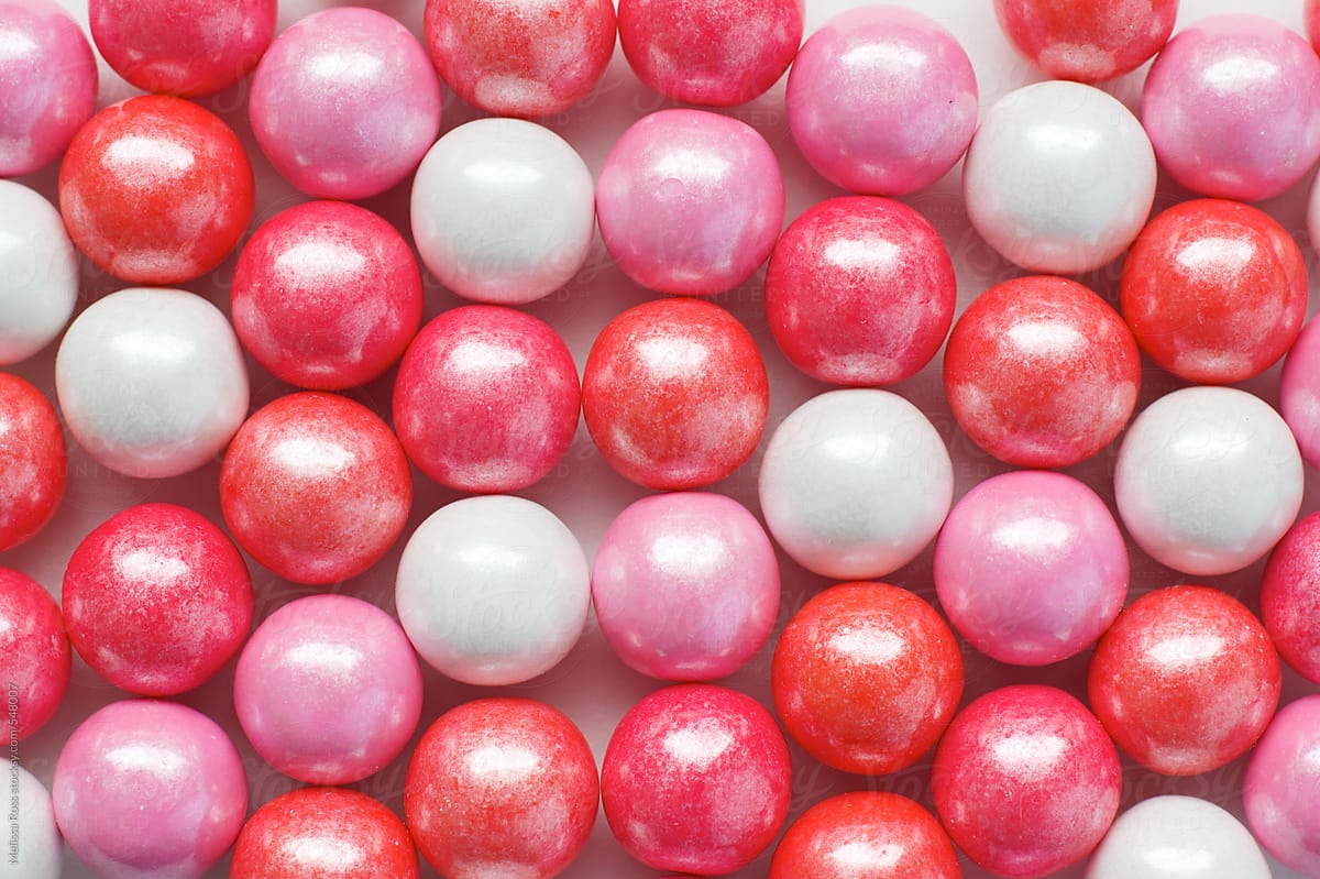 Overhead Shot Of Gum Balls Spread Out On A White Background by Stocksy  Contributor Melissa Ross - Stocksy