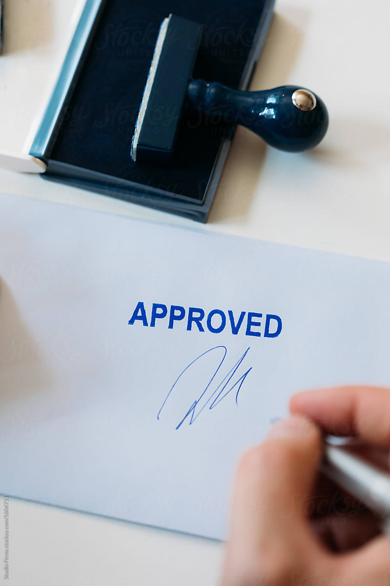 Man Signing Approved Document
