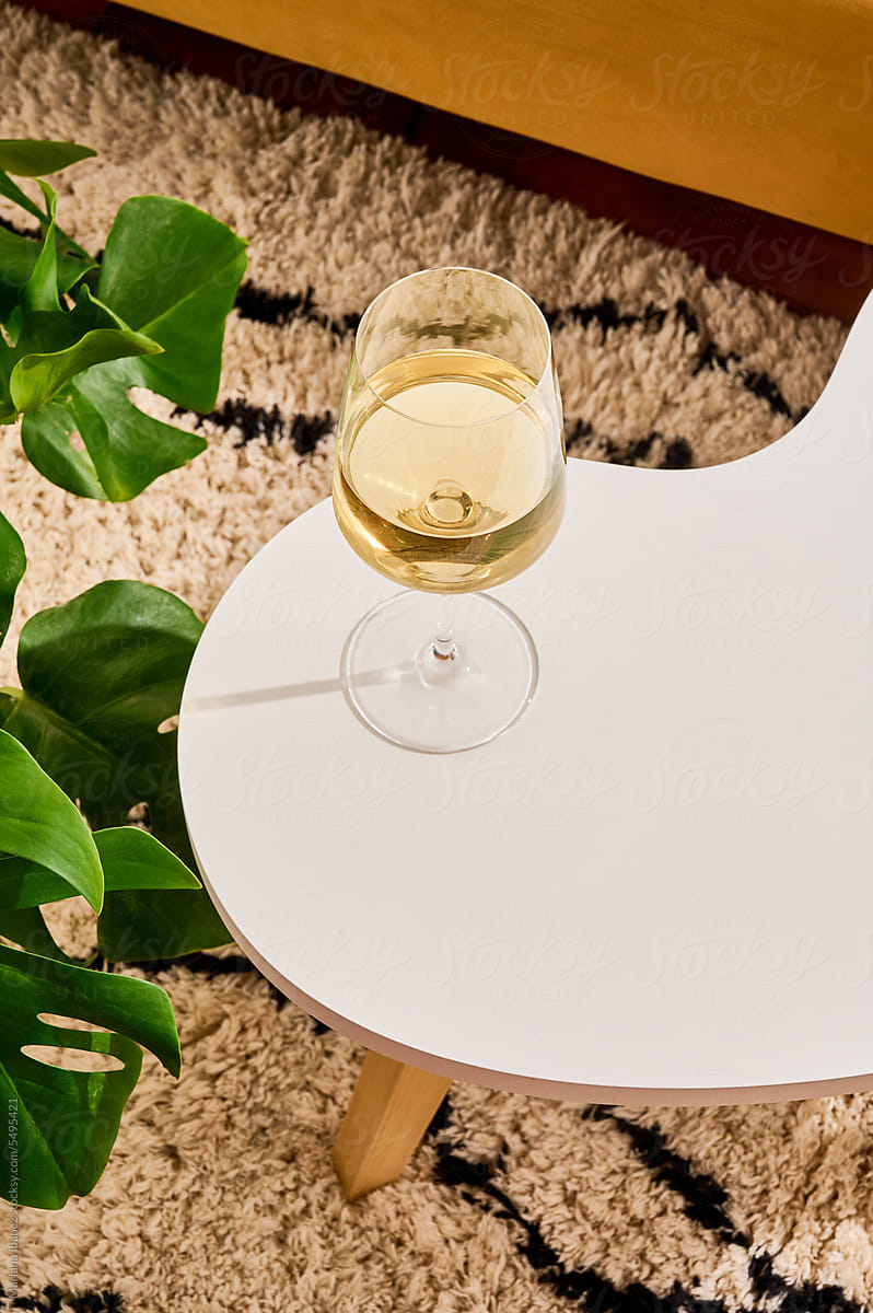 Glass of white wine in living room