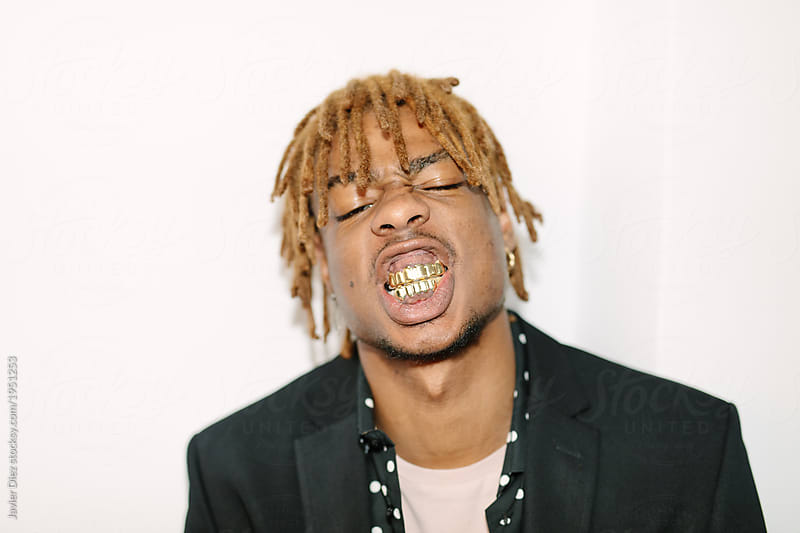 Black boy with gold teeth and cocky attitude