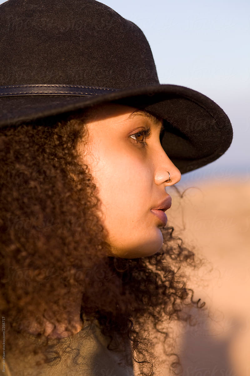 young black woman with hat