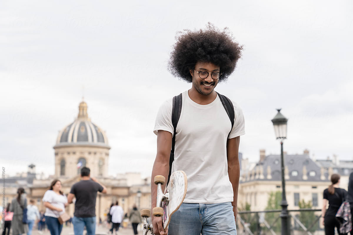Skater With Afro Hair Walking In Paris