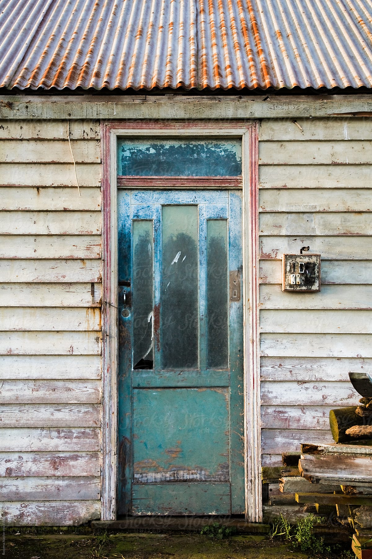 Old door or an abandoned country cottage