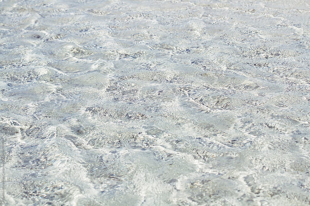 Transparent clear water texture on a tropical beach