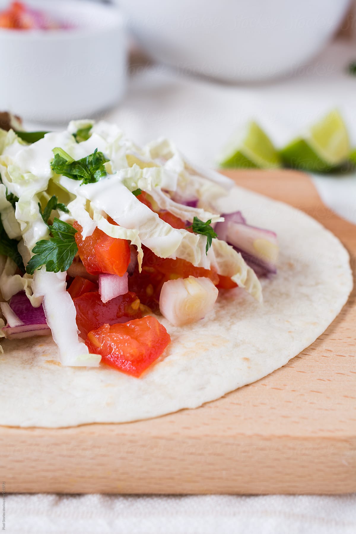 Food: close-up of tacos with roasted chicken, sour cream and vegetables
