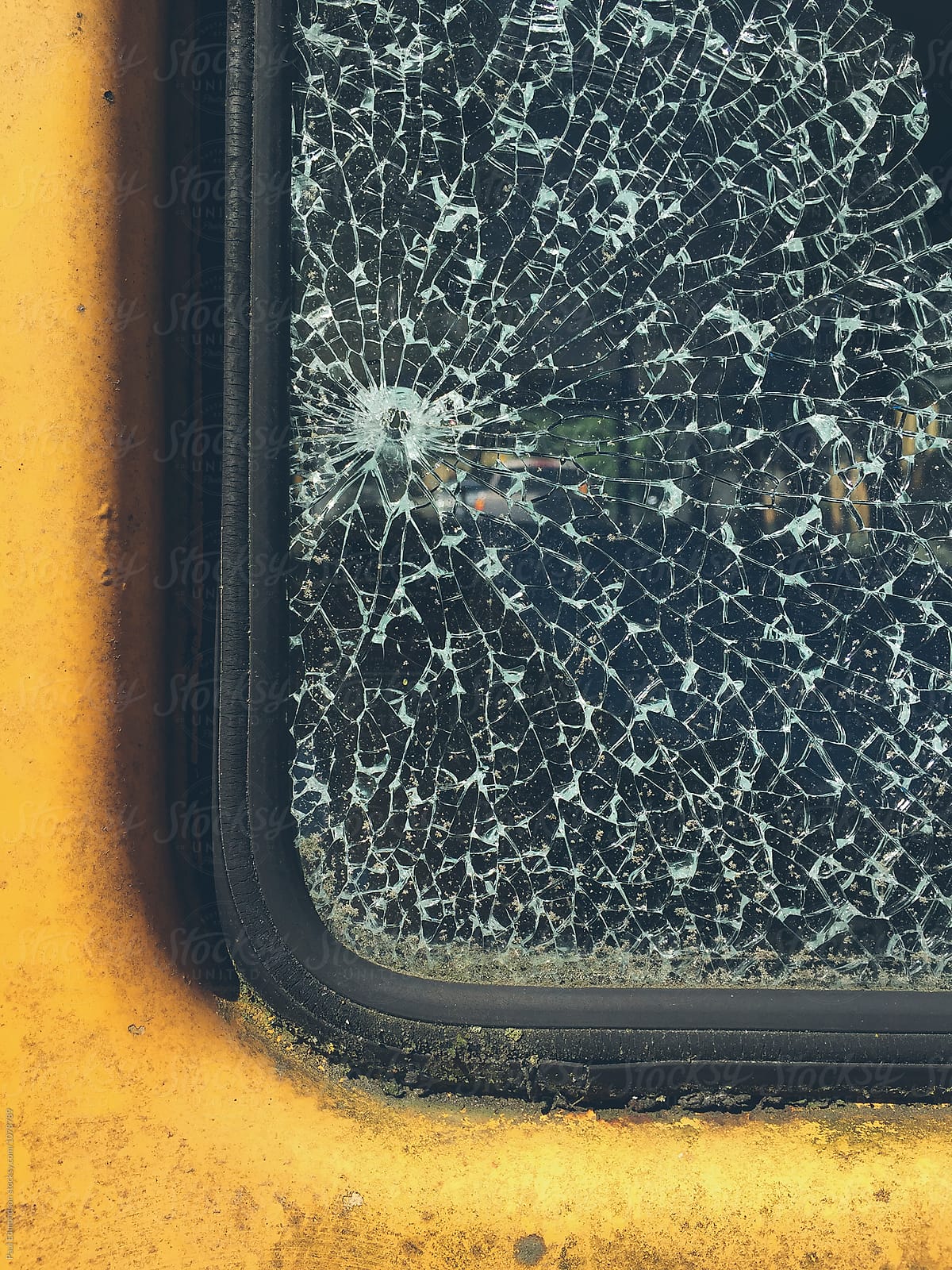 Detail of car door and shattered window