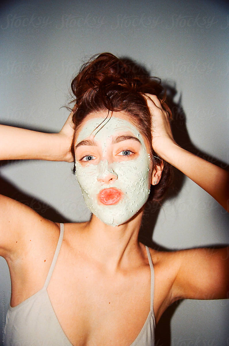 Woman Playful Facial Mask Beauty Session with flash